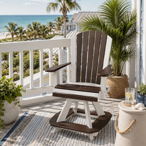 Coastal balcony with a two-tone poly Adirondack swivel chair overlooking the beach, accented by tropical plants and décor.