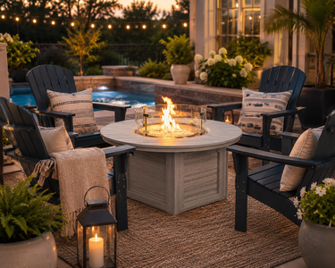 Modern poly fire pit and poly Adirondack chairs create a cozy backyard gathering space by the pool