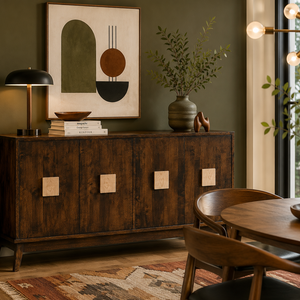 Mid-century modern dining room featuring a solid wood sideboard with geometric accents, warm décor, and olive green walls.