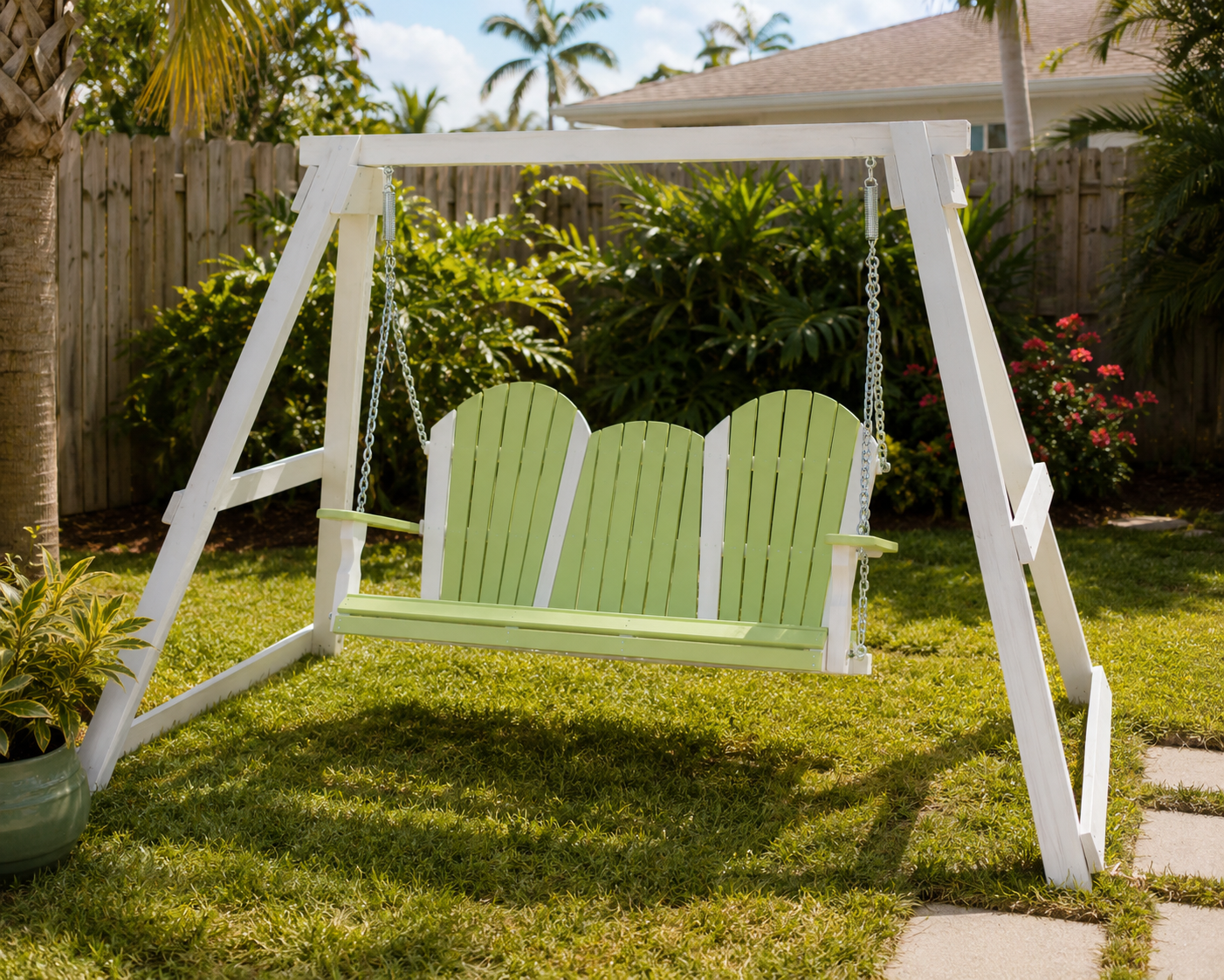 Weather resistant poly wood A frame outdoor swing in a Florida backyard in lime green and white shades.