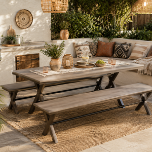 Powder coated steel and poly outdoor dining table with matching benches on a covered patio for stylish outdoor dining.
